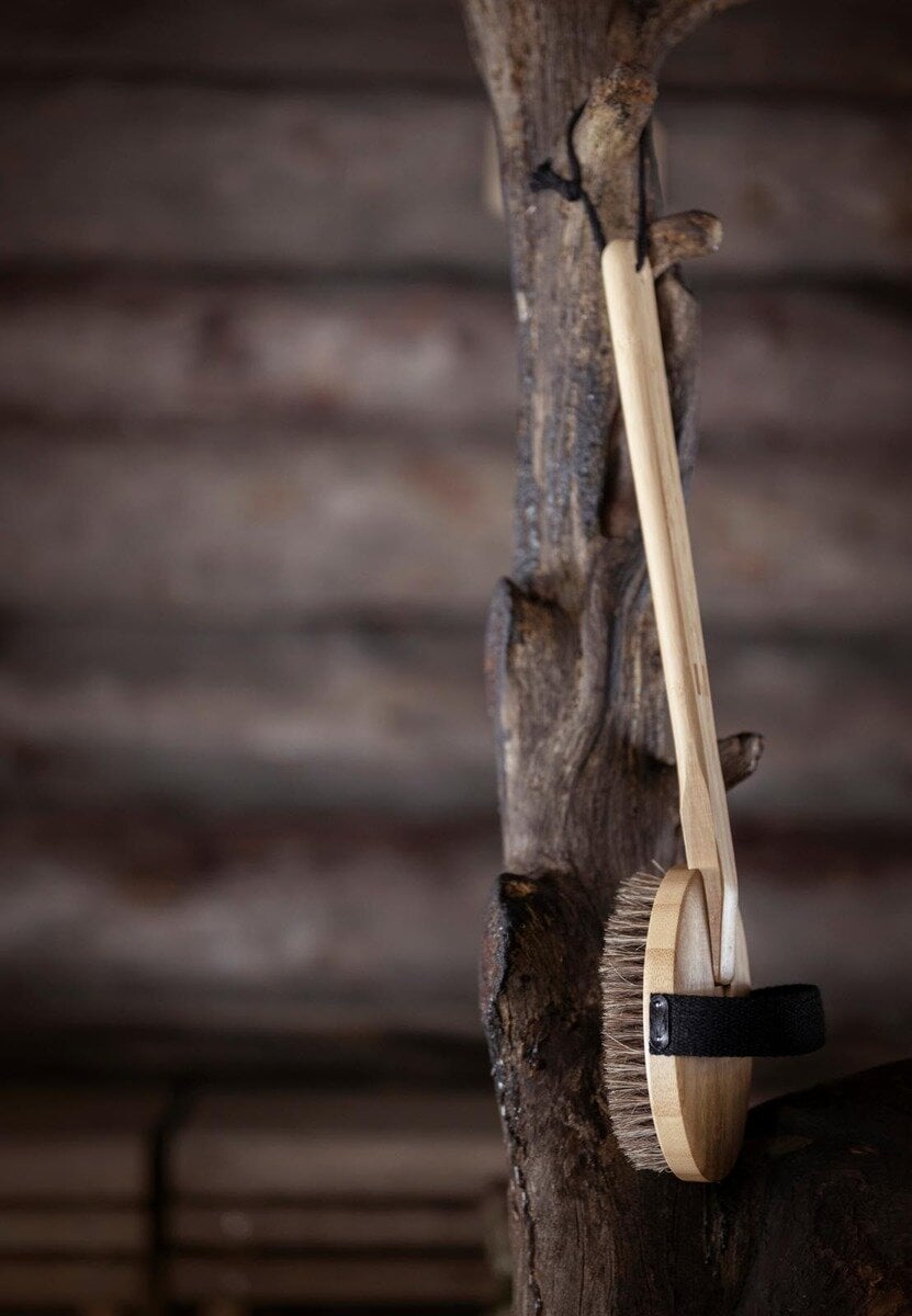 Bamboo sauna brush for cleaning and relaxation.