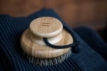 Bamboo body brush for skin care and exfoliation.