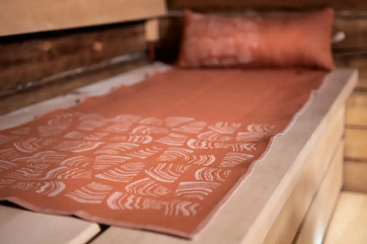 Brown Rento Pino sauna cushion for relaxation and comfort.