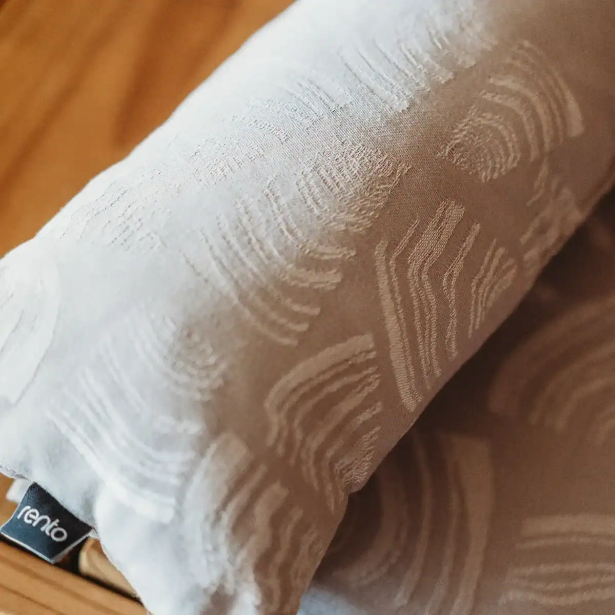 Beige sauna cushion by Rento Pino for extra comfort while relaxing.