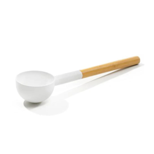 White wooden sauna ladle for use in the sauna or spa.