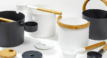 Round bathroom set made of bamboo and black plastic, including buckets and accessories.