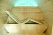 Outdoor sauna for 6 people with wooden interior and accessories.