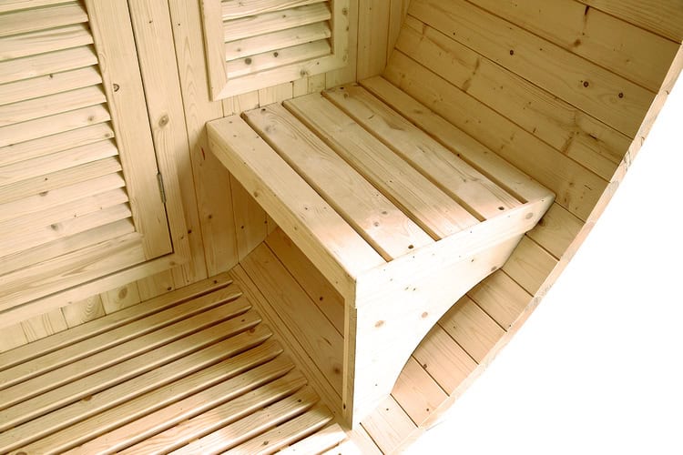 Outdoor sauna for 6 people with wooden bench and accessories.