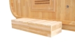 Outdoor sauna made of spruce wood with wooden bench and ventilation holes.
