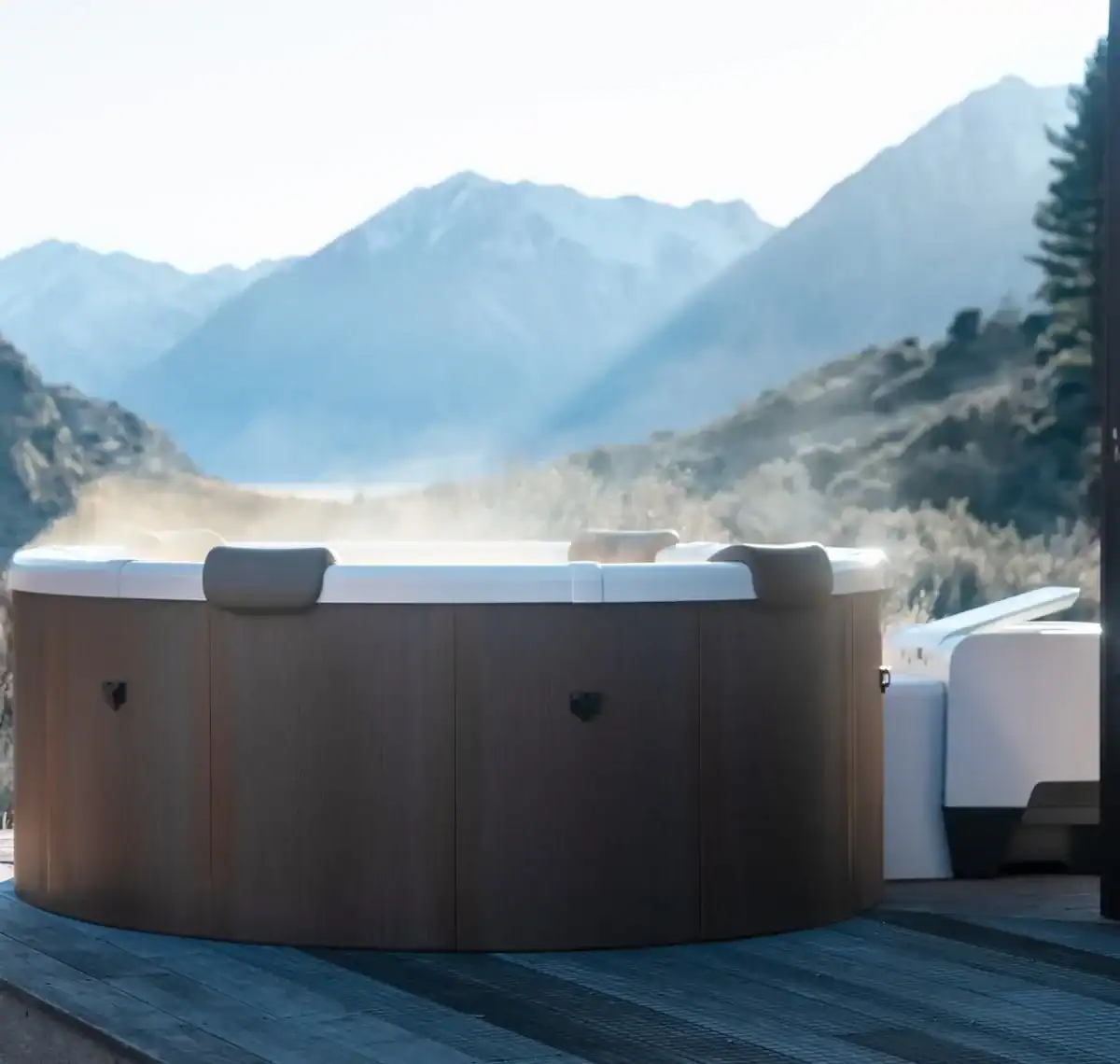 Rova frame spa for 6 people on a terrace with a mountain landscape.